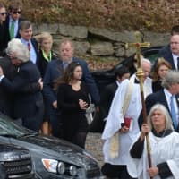 <p>A large procession leaves St. James Episcopal Church in North Salem following the funeral of Lois Colley. The procession is from the church to a nearby cemetery.</p>