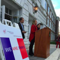 <p>Renée Ketcham, president of Greenwich&#x27;s Alliance Francaise, speaks during a ceremony in memory of those killed in last week&#x27;s terrorist attacks in Paris. At left is First Selectman Peter Tesei. The French flag was raised in front of Town Hall.</p>