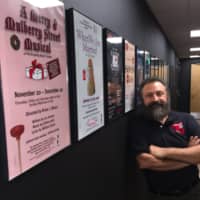<p>Curtain Call Theatre&#x27;s executive director Lou Ursone stands against what used to be an exterior wall at the Dressing Room Theatre but now is an interior wall after an $800,000, 2,500 square foot expansion to the building.</p>
