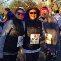 <p>Kaye Leong with her daughters (left) Jenni and (right) Kat, both from Manhattan at the 38th Annual Pequot Runners Thanksgiving Day race in Southport. </p>