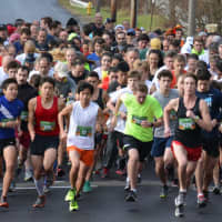 <p>Runners start the 11th annual Bedford Turkey Trot.</p>
