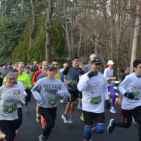 <p>Runners start the 11th annual Bedford Turkey Trot.</p>