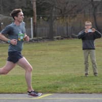 <p>Philip Cawkwell, pictured, heads towards the finish line at the 11th annual Bedford Turkey Trot. Cawkwell won his third turkey trot on Saturday.</p>