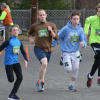 <p>Runners head towards the finish line at the 11th annual Bedford Turkey Trot.</p>