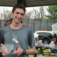 <p>Philip Cawkwell holds his award following his third win at the Bedford Turkey Trot.</p>