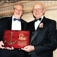 <p>Admiral Robert J. Papp Jr., USCG (Ret.) presents the David A. O’Neil Sheet Anchor Award to NMHS chairman Ronald L. Oswald (at left). </p>