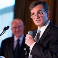 <p>Joe DePaolo, CEO of Signature Bank, speaks at the dinner. He received the Alfred B. DelBello Visionary Award.</p>