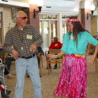 <p>A member of the Waveny LifeCare Network&#x27;s Adult Day program dances during the &quot;cruise day&quot; theme at the New Canaan facility. </p>