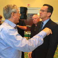 <p>Gov. Dannel Malloy listens to a question after he spoke Wednesday at the Retired Men&#x27;s Association of Greenwich.</p>