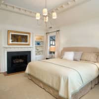 <p>The master bedroom includes a fireplace.</p>