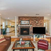 <p>The family room includes a fantastic fireplace.</p>