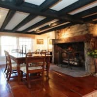 <p>The home at 236 Eastwoods Road includes five fireplaces, wide-plank pine flooring and gorgeous beams.</p>