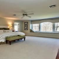 <p>The master bedroom is massive in the Pound Ridge home, which has 4,901 square feet of living space.</p>