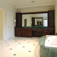 <p>Spaciousness rolls throughout the home, as shown here in the master bath.</p>