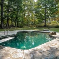 <p>An inground pool is one of the amenities at the home at 36 Chestnut Ridge Road in Bedford Corners.</p>