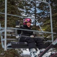 <p>A happy skier enjoys the ride on the chairlift Friday at Ski Sundown.</p>