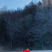 <p>A skier glides down Ski Sundown Friday in New Hartford, Conn.</p>