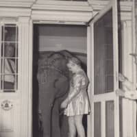 <p>A vintage photo of a circus elephant entering the Elephant Hotel in Somers.</p>