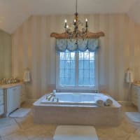 <p>An elegant and bright master bath adds to the home&#x27;s appeal.</p>