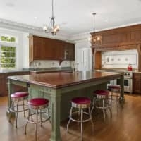 <p>The expansive kitchen features this grand center island.</p>