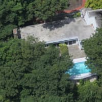 <p>An aerial view of the property and the pool in the backyard.</p>