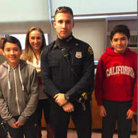 <p>Greenwich Police Officer Ryan Beattie with Western Middle School Grade 8 students VictorColin, at left, and Derek Silva, at right, and Grade 7 and 8 Science teacher Tyler Mecozzi.</p>