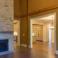 <p>A magnificent stone fireplace is featured in one of the rooms.</p>