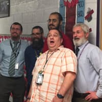 <p>Garfield High School staff prepare for a shave as part of a fundraiser.</p>