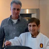 <p>John Aramian of Ridgewood with a cook he featured on Peasant Chef TV.</p>