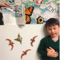 <p>Tommy Mullen recreated scenes from a dinosaur book during Winter Detectives Vacation Club in Scarsdale.</p>