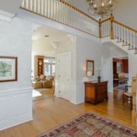 <p>The home includes an open floor plan with 9-foot ceilings, gorgeous molding and hardwood floors.</p>