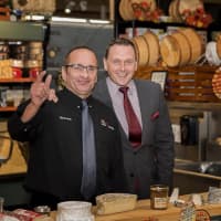 <p>Uncle G&#x27;s wine and cheese experts come together for a photograph. The store will open a Ramsey location in the fall.</p>