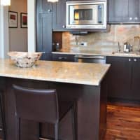 <p>The kitchen includes updated appliances and granite countertops.</p>
