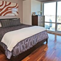 <p>Like the rest of the condo, the master bedroom offers compelling views.</p>
