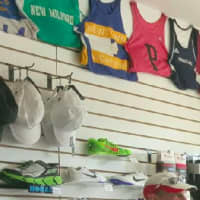 <p>Caps and team shirts at Woodbridge Running Company</p>