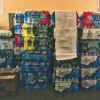 <p>More than 100 cases of water were collected in New Rochelle over the weekend, which will soon be shipped to Flint, Mich. through a Yonkers trucking company.</p>