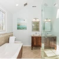 <p>The master bathroom features both a shower and bathtub to help relax after a long day.</p>