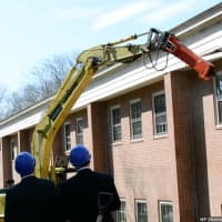 <p>Demolition of an ancillary building at Chappaqua Crossing was started moments after a ceremonial groundbreaking for the site&#x27;s retail project was held.</p>