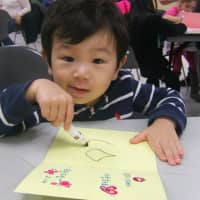 <p>A youngster makes a Valentine&#x27;s Day card at the Leonia Library.</p>