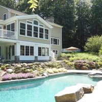 <p>The 34 Merry Lane property offers a beautiful pool and entertainment area, as well as a finely manicured backyard.</p>