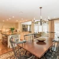 <p>The kitchen and dining area are bright and open at the Merry Lane property.</p>