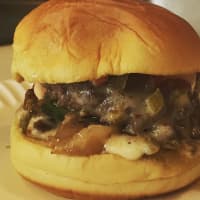 <p>Holy Cow Slider&#x27;s double chipotle cheeseburger with caramelized onions, chipotle mayo, jalapeños and pepper jack.</p>