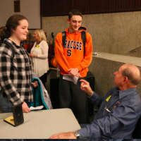 <p>91-year-old Dave Mann spoke to students about his experiences during and after the war in the auditorium at the school.</p>