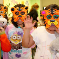 <p>Members of the Boys and Girls Club enjoy their time at the event making tiger masks.</p>