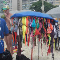 <p>I flew into Rio De Janeiro (which means “River of January”) with my friends Sylvia and Chuck to participate in Carnival (which means “no meat”). Our hotel was wonderful – right on Coco Cabaña Beach. They sold bikinis hanging from a beach umbrella.</p>