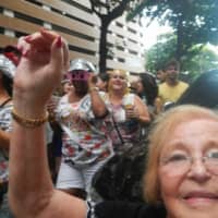 <p>Everyone was marching in the street parades (Bloco de Lama) for days before and after, chanting, drinking and laughing. I decided to join the parade one day and they welcomed me with open arms. I marched, danced and sang.</p>