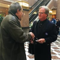 <p>Abilis CEO Dennis Perry speaks with Walt Kita, of Kuhn Employment Opportunities, in the Legislative Building in Hartford.</p>