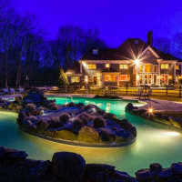 <p>The lazy river pool sparkles at night.</p>