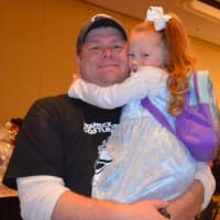 <p>Teaneck Detective Ed Kazmierczak with his daughter at Sunday&#x27;s PBA fundraiser in parts for River Edge&#x27;s Baby Luke.</p>