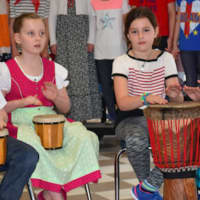 <p>Stephen Smith, Nadja Roeser, Charlotte Ruhe and Katie Ruhe play drums to the Nigerian song &quot;Funga Alafia.&quot;</p>